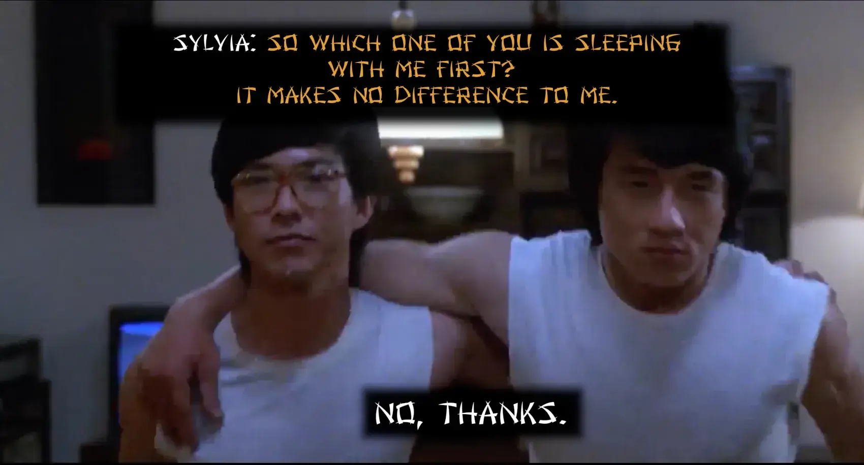 Image of Thomas and David turning down Sylvia in Wheels on Meals. In their living room, Thomas and David hug each other with one arm as they walk away from Sylvia toward their room. Right before they turn away from Sylvia, they look at each other and simultaneously say "No, Thanks.". Sylvia had just asked them; "So which one of you is sleeping with me first? It really doesn't make a difference to me."