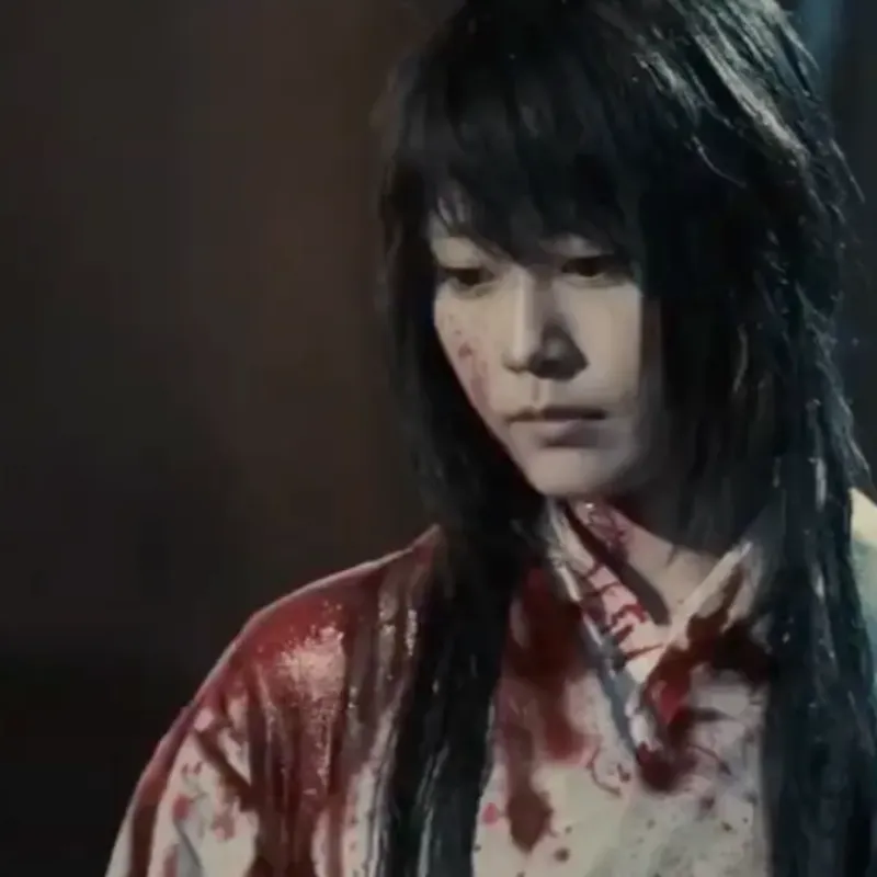 Scene with lady Tomoe from Rouroni Kenshin: The Beginning. Specifically, this is the scene where we see Lady Tomoe for the second time in the movie. This happens outside of the inn where Tomoe and Kenshin first meet. Lady Tomoe is covered in blood. pale, staring down at Kenshin.